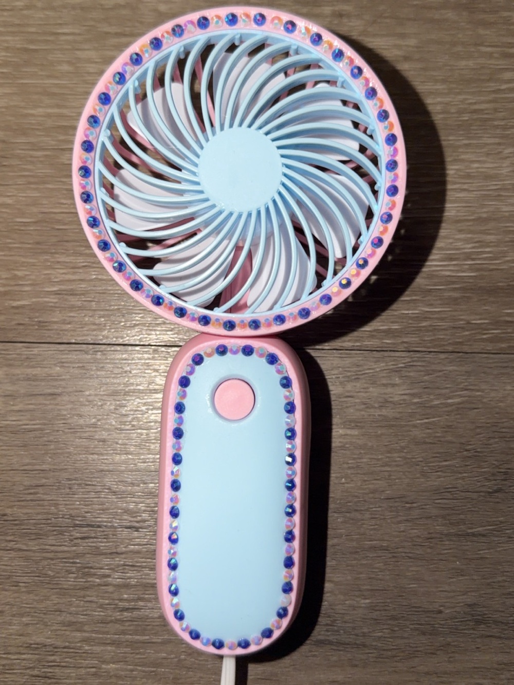 pink & blue handheld fan with dark purple & white rhinestones